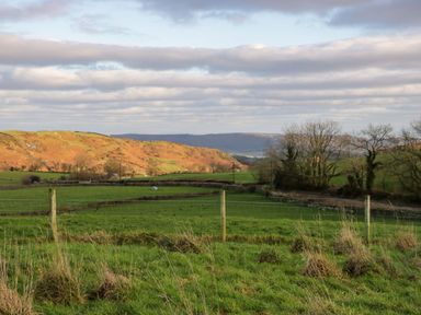 A landscape view with hills and trees at Oak in Ulverston