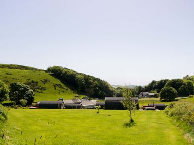 An outdoor view of buildings and hills at Cherry in Ulverston