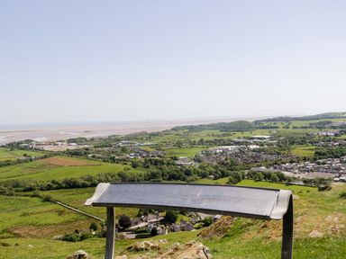 A viewpoint overlooking a landscape with hills and a river at Cherry in Ulverston