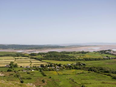 A landscape view with fields and a river at Cherry in Ulverston