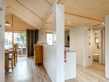 A kitchen with dining area at Lodge 16 in Corfe Castle