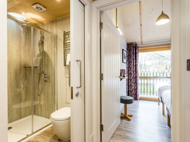 A bathroom with shower and toilet at Lodge 17 in Corfe Castle