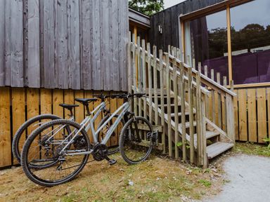 A staircase leading to a building with bicycles parked at Lodge 19 in Corfe Castle