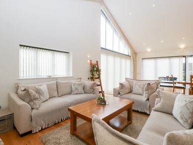A living room with sofas and a coffee table at Bilsham Meadows, Aust