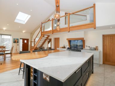 A kitchen with a large island and stove at Bilsham Meadows in Aust