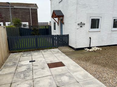 An outdoor area with a fence and pathway at 22 Longstone Park Beadnell