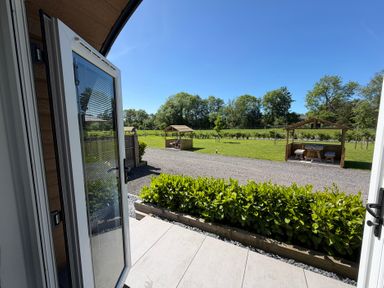 A garden view with gazebo and furniture at Oh Deer in Ashbourne