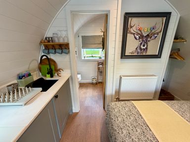 A kitchen with a sink and bed at Oh Deer Ashbourne