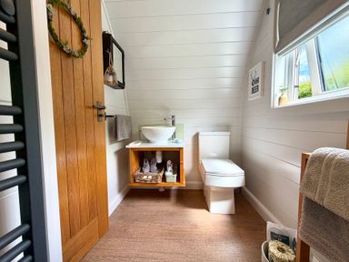 A bathroom with a toilet and sink at Oh Deer Ashbourne