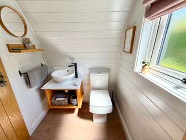 A bathroom with a sink and toilet at No Deer Ashbourne