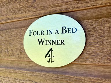 A plaque indicating winner of Four in a Bed