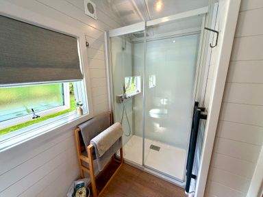 A bathroom with a shower and a window at No Deer in Ashbourne