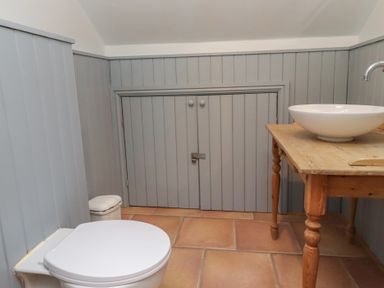 A bathroom with sink and toilet at Rose House in Alnmouth