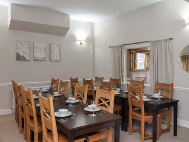 A dining room with tables and chairs at Bridlington Bay House in Bridlington