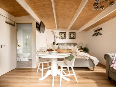 A studio room with a table and chairs at Hazel in Blandford Forum