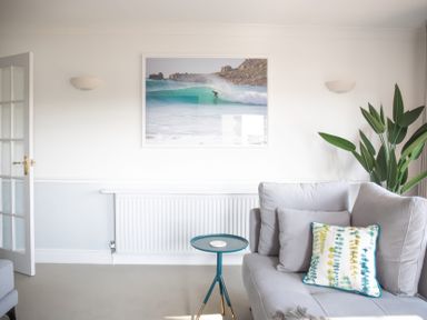 A living room with a sofa and a coffee table at Newquay Tamarisk Lodge on the Gannel Newquay