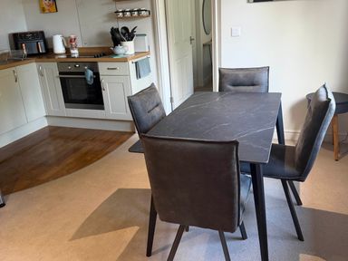 A dining room with a table and chairs at The Annexe in Bridlington
