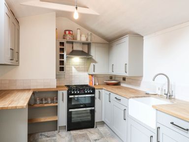 A kitchen with a stove and sink at 5 Prospect Place in Woodbridge