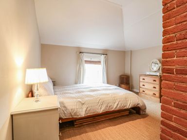 A bedroom with a bed and dresser at 5 Prospect Place in Woodbridge