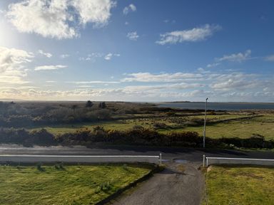 A view of water and land from a distance at Geesala
