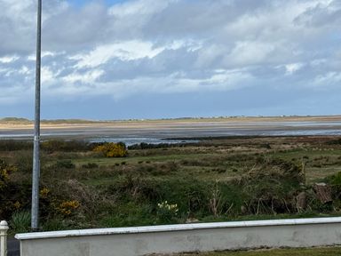 A view of water and landscape from a location at Geesala