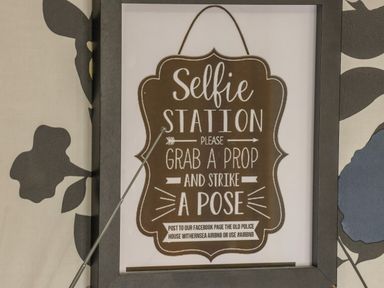 A framed sign on a wall with instructions for a selfie station at The Old Police House in Withernsea