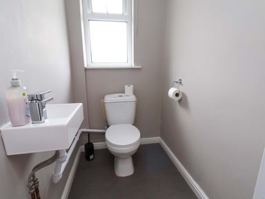 A bathroom with a sink and toilet at Hazelgarth House in Hunmanby