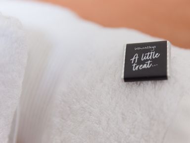 A towel with a chocolate label at Carines Barns - Tre, Cubert