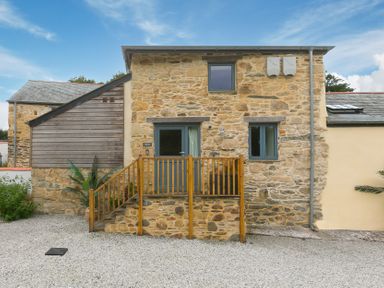 A building entrance with steps and windows at Carines Barns - Pen in Cubert
