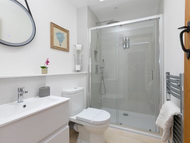 A bathroom with a shower and sink at Carines Barns - Pen in Cubert
