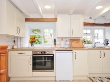A kitchen with a refrigerator and an oven at Henwood Barn in Henwood near Upton Cross