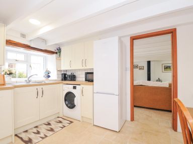 A kitchen with a sink and appliances at Henwood Barn Henwood near Upton Cross