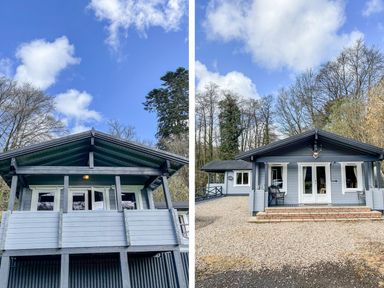 A grey wooden cabin with a porch and gravel driveway surrounded by trees at Valley Lodge in Oakfordbridge near Bampton