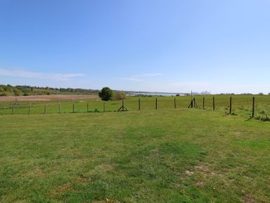 A field with a fence and tree at Polly's Annexe Levington