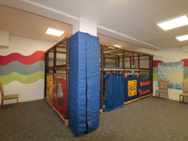 An indoor play area with a soft play structure and chairs against the wall at The Olive Lodge 227 Sycamore in New Milton