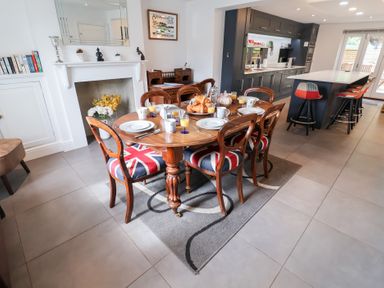 A dining room with a table set for breakfast at Cavan Cottage Yoxford