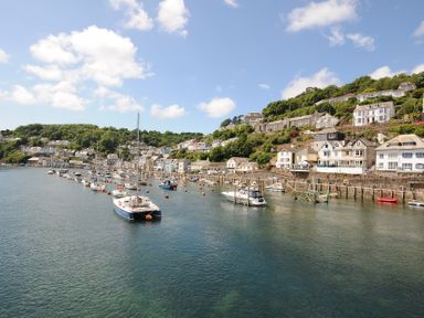 A waterfront with boats and houses at 3 River View Looe