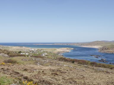A coastal landscape with a village near a river and beach at Inverbeg Cottage 1 in Downings