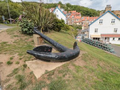 An anchor displayed on a grassy area at Mayflower Lodge, Runswick Bay near Staithes