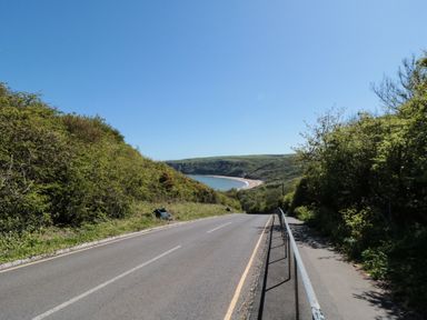 A view of a road leading down to the sea at Foxglove Lodge in Runswick Bay near Staithes