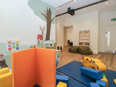 A play area with colorful mats and toys at Beech Timber Lodge in Keswick