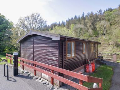 A cabin with gas canisters and a power outlet at Elm Lodge in Keswick