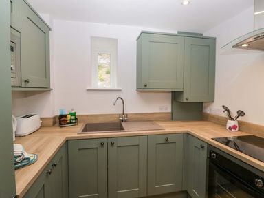 A kitchen with a sink and countertop at Riverside Cottage No 5 in Keswick