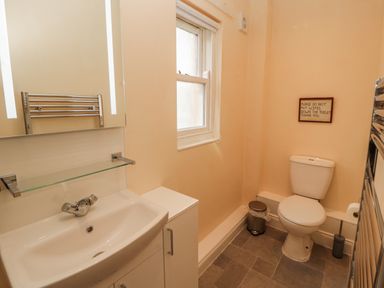 A bathroom with a sink and toilet at Flat 17 in Keswick