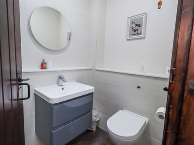 A bathroom with a sink and toilet at Horse and Farrier Barn Newton in Cartmel near Cartmel