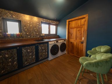 A laundry room with washing machine and dryer at Wonderland in Tweedmouth, Berwick-Upon-Tweed
