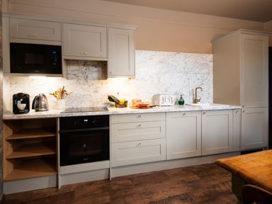 A kitchen with appliances and countertop at Wonderland in Tweedmouth, Berwick-Upon-Tweed