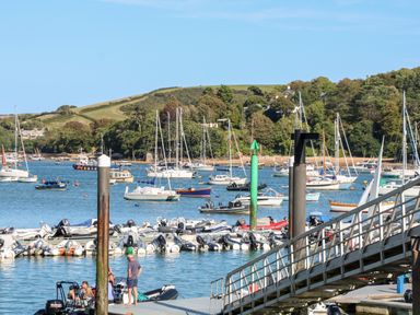 A marina with boats on water and green hills in the background at 1 Camperdown Lodge in Salcombe