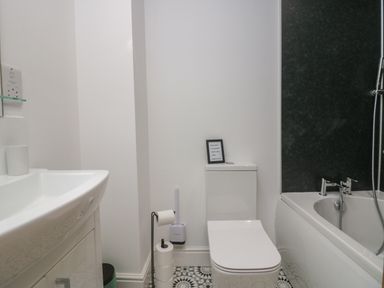 A bathroom with a sink toilet and bathtub at Dalegarth Hall Farm Cottage 1 Boot near Eskdale Green