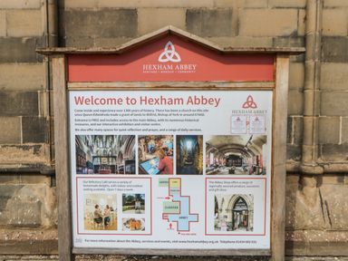 An information board welcoming visitors to Hexham Abbey with text history images and a map at Hexham Abbey in Riding Mill near Corbridge
